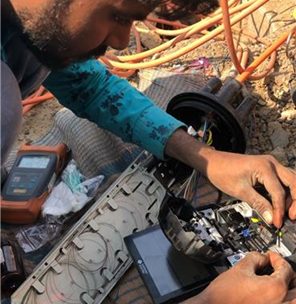 Optical network installation work in India.