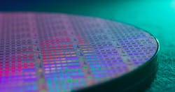 A 300-mm wafer of Ayar Labs TeraPHY optical I/O chiplets. The latest funding round will help the company ramp production.