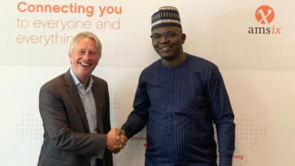 International Partnership Director Onno Bos (left) of AMS-IX and Oluwasayo Oshadami (right), GM, Technical Solutions, MainOne, signed the deal during the African Peering Forum (AfPIF) in Kigali.