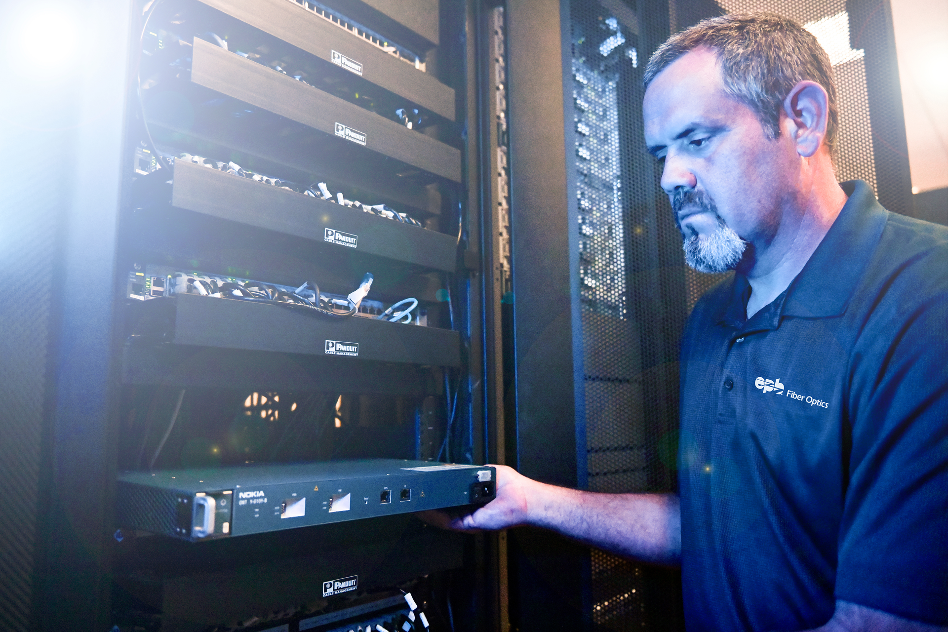 EPB of Chattanooga Field Services Technician J.T. Shankles installs a Nokia 25G PON optical network termination (ONT) unit.