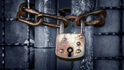 An old, rusty padlock and chain. An old, rusty padlock and chain.