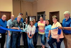 Mayor Chuck Steele cuts the ribbon alongside community leaders and Surf Internet representatives to mark the arrival of fiber-optic internet service in Momence, Ill., on Sept. 24, 2025. Mayor Chuck Steele cuts the ribbon alongside community leaders and Surf Internet representatives to mark the arrival of fiber-optic internet service in Momence, Ill., on Sept. 24, 2025.