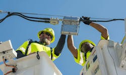 Comcast technicians install advanced broadband infrastructure as the company expands Internet access across Florida. Comcast technicians install advanced broadband infrastructure as the company expands Internet access across Florida.