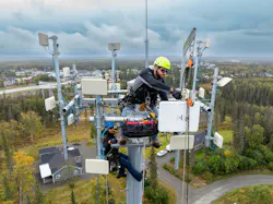 Alaska Communications technicians install fixed wireless equipment on the Kenai Peninsula during a recent network expansion. Alaska Communications technicians install fixed wireless equipment on the Kenai Peninsula during a recent network expansion.
